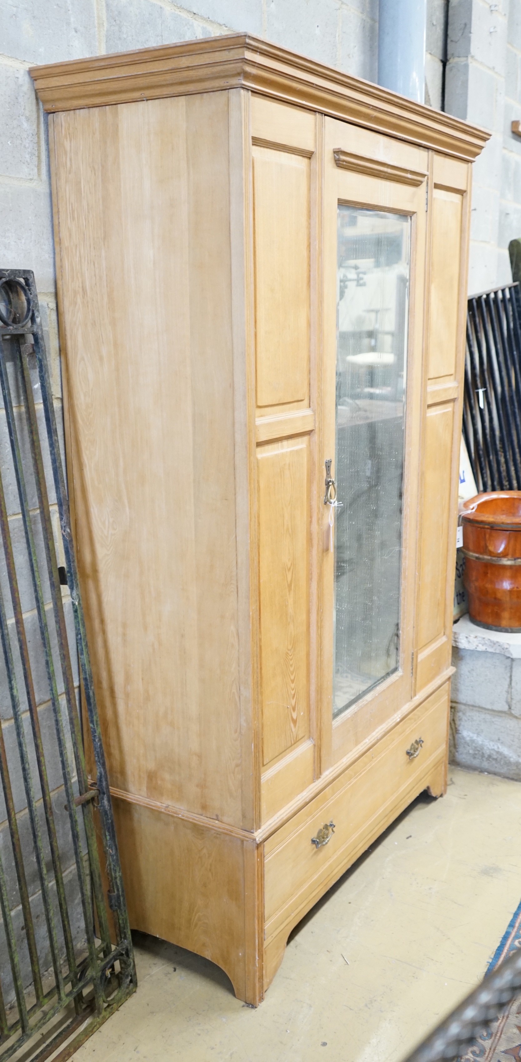 A late Victorian ash mirrored door wardrobe, length 122cm, depth 54cm, height 205cm